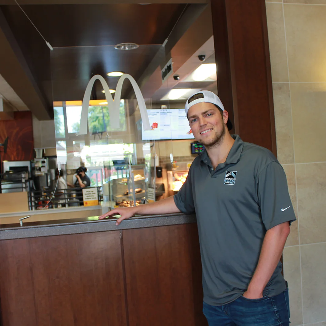 A Field Advisor at the counter inside a client restaurant