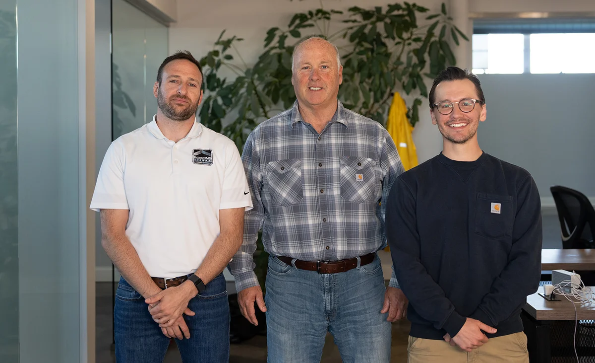 Three RoofingSource office teammates at headquarters
